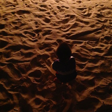 I really like this picture of a little boy in the sand
